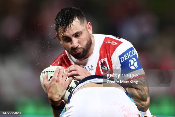 Jack Bird of the Dragons is tackled during the round two NRL match between the St George Illawarra Dragons and the Gold Coast Titans at Netstrata...