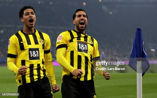 Jude Bellingham of Dortmund and Emre Can of Dortmund celebrate after Raphael Guerreiro of Dortmund scored the second goal during the Bundesliga match...