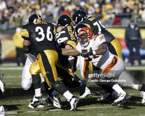 Linebacker Kevin Hardy of the Cincinnati Bengals attempts to tackle running back Jerome Bettis of the Pittsburgh Steelers during a game at Heinz...