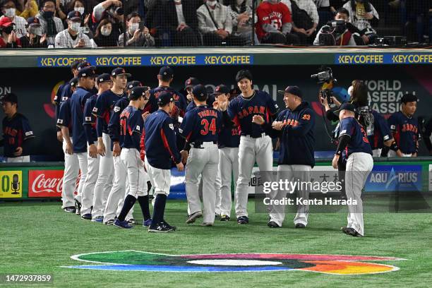 Japanese players celebrate after the first inning during the World Baseball Classic Pool B game between Japan and Australia at Tokyo Dome on March...