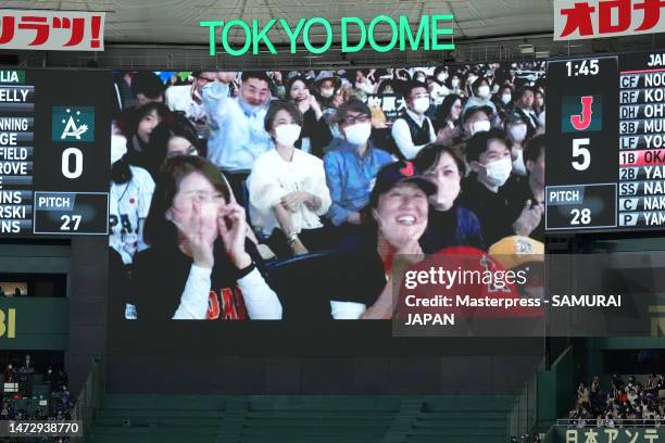 The giant screen displays the mother of Lars Nootbaar during the World Baseball Classic Pool B game between Japan and Australia at Tokyo Dome on...