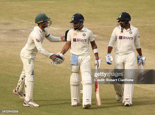 Alex Carey of Australia acknowledges Virat Kohli of India after he finished his innings with 186 runs during day four of the Fourth Test match in the...