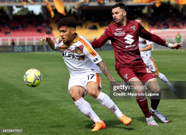 Valentin Gendrey of Lecce competes for the ball with Nemanja Radonjic of Torino during the Serie A match between US Lecce and Torino FC at Stadio Via...