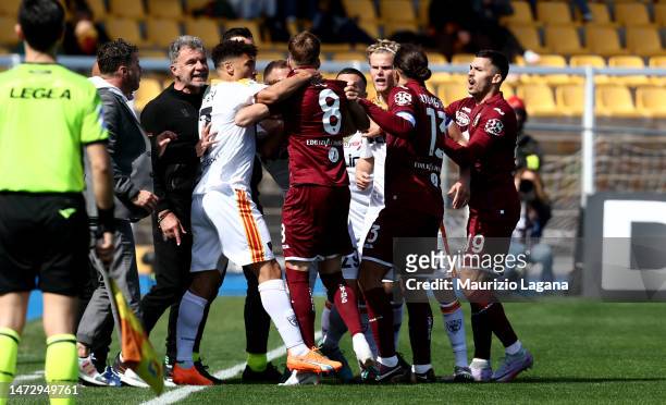 Players of Lecce and players of Torino react during the Serie A match between US Lecce and Torino FC at Stadio Via del Mare on March 12, 2023 in...