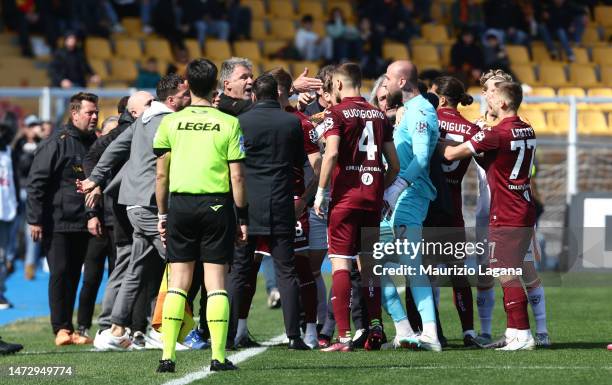 Players of Lecce and players of Torino react during the Serie A match between US Lecce and Torino FC at Stadio Via del Mare on March 12, 2023 in...