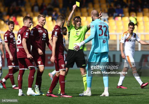 The referee Juan Luca Sacchi shows the yellow card to Vanja Milinkovic-Savic of Torino during the Serie A match between US Lecce and Torino FC at...