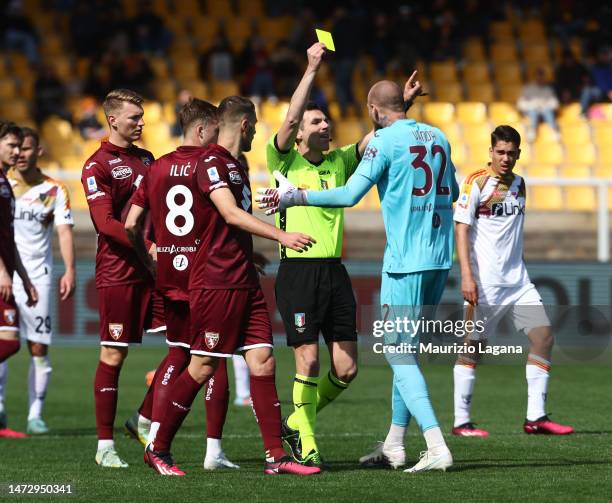 The referee Juan Luca Sacchi shows the yellow card to Vanja Milinkovic-Savic of Torino during the Serie A match between US Lecce and Torino FC at...