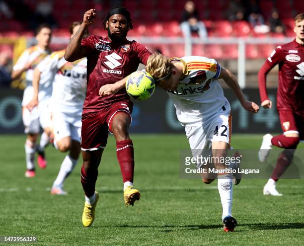 Morten Hjulmand of Lecce competes for the ball with Andrew Gravillon of Torino during the Serie A match between US Lecce and Torino FC at Stadio Via...