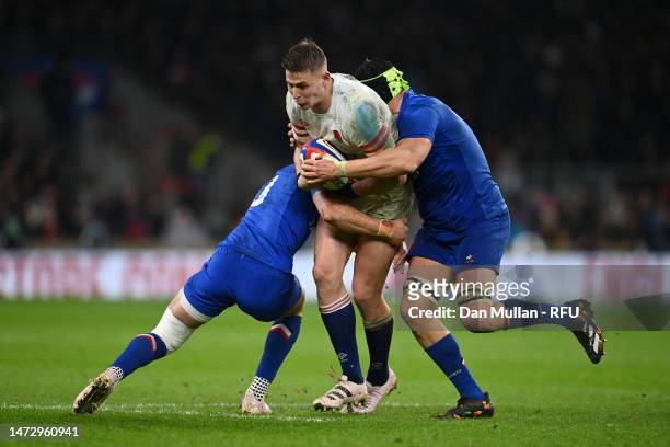 Freddie Steward of England is tackled by Romain Ntamack and Gregory Alldritt of France during the Six Nations Rugby match between England and France...