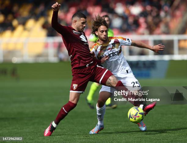 Antonino Gallo of Lecce competes for the ball with Antonio Sanabria of Torino during the Serie A match between US Lecce and Torino FC at Stadio Via...