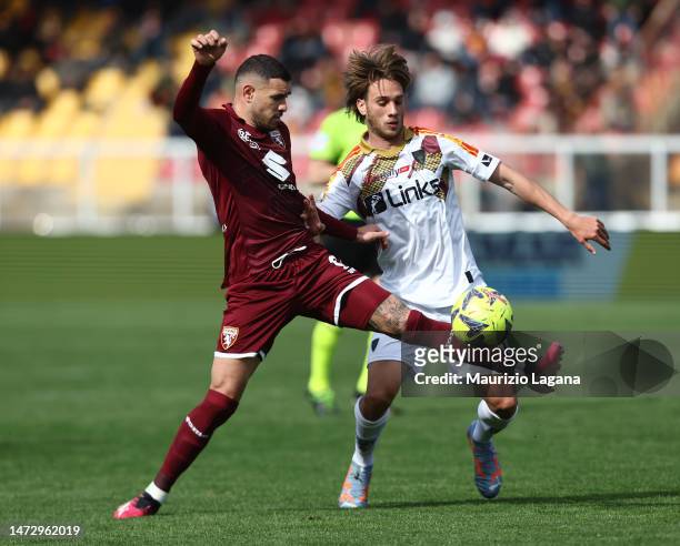 Antonino Gallo of Lecce competes for the ball with Antonio Sanabria of Torino during the Serie A match between US Lecce and Torino FC at Stadio Via...