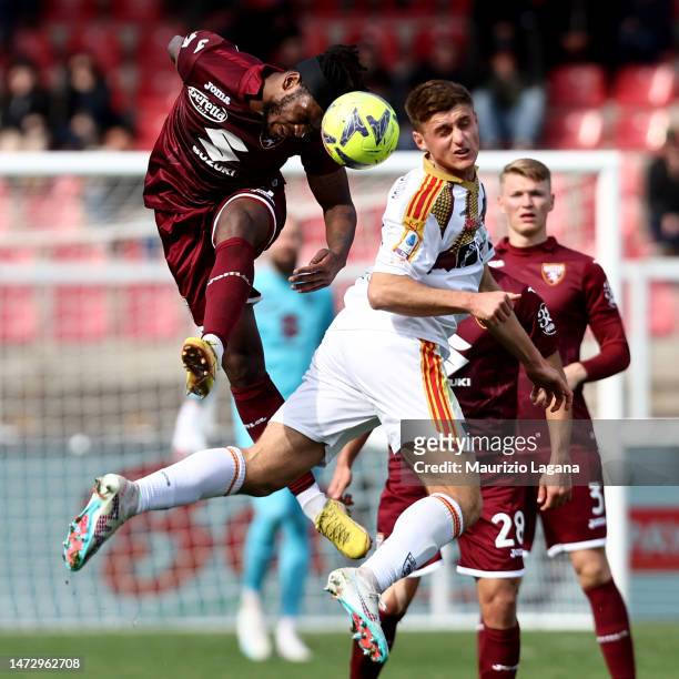 Lorenzo Colombo of Lecce competes for the ball with Andrew Gravillon of Torino during the Serie A match between US Lecce and Torino FC at Stadio Via...