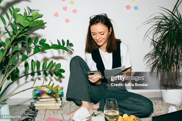 young modern woman in her work place at home - flash ストックフォトと画像