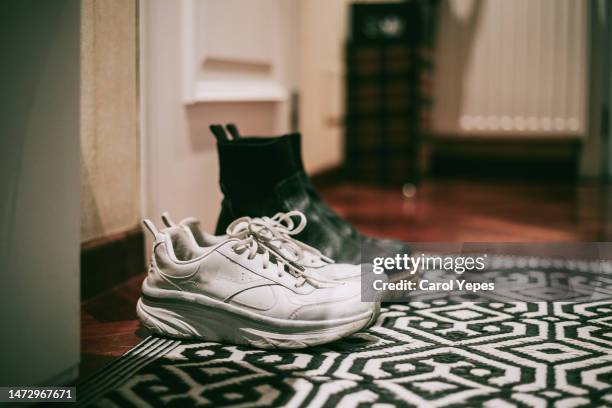 family shoes at home - front door stock pictures, royalty-free photos & images