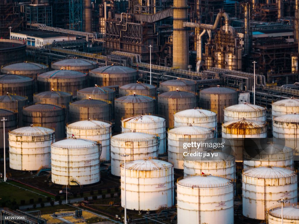 Oil storage tanks in a petrochemical plant arranged in order. Guangxi Province, China.