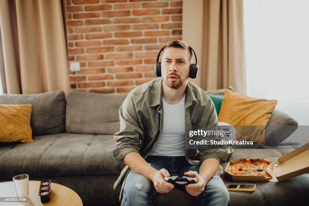 Guy playing a video game with a joystick