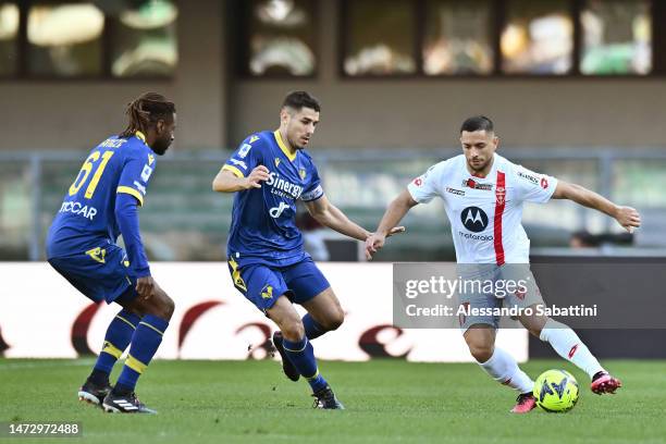 Marco Davide Faraoni of Hellas Verona battles for possession with Gianluca Caprari of AC Monza during the Serie A match between Hellas Verona and AC...