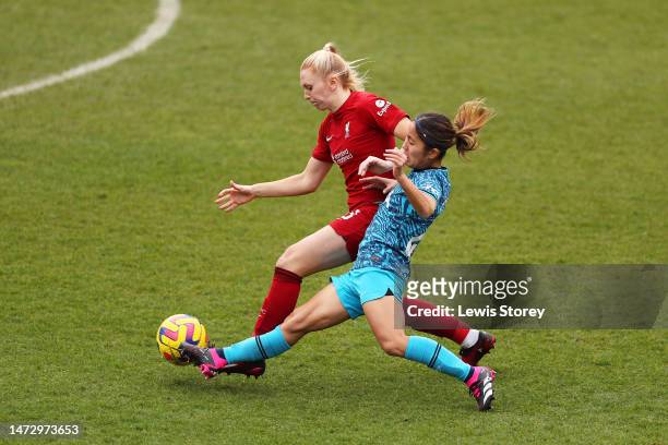 Ceri Holland of Liverpool is tackled by Mana Iwabuchi of Tottenham Hotspur during the FA Women's Super League match between Liverpool and Tottenham...