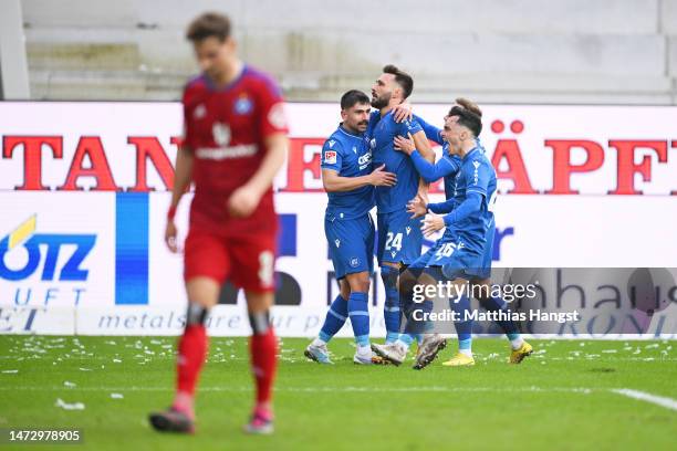 Fabian Schleusener of Karlsruher SC celebrates with teammates after scoring the team's fourth goal during the Second Bundesliga match between...