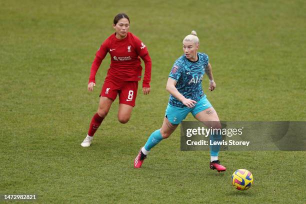 Bethany England of Tottenham Hotspur runs with the ball past Fuka Nagano of Liverpool during the FA Women's Super League match between Liverpool and...