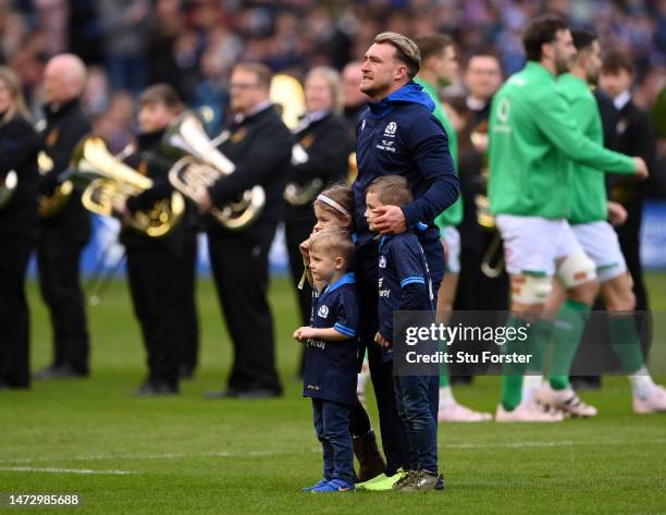 Stuart Hogg of Scotland, with his children, is presented to the crowd before making his 100th Cap Appearance during the Six Nations Rugby match...
