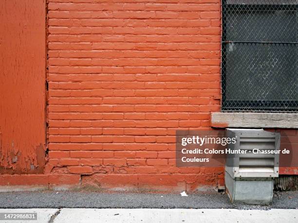 painted and weathered brick wall and wood panel with ventilation grid, window and asphalt floor in montreal - ventilator illustration stock pictures, royalty-free photos & images