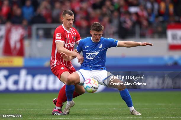 Finn Ole Becker of TSG Hoffenheim battles for possession with Maximilian Eggestein of Sport-Club Freiburg during the Bundesliga match between...