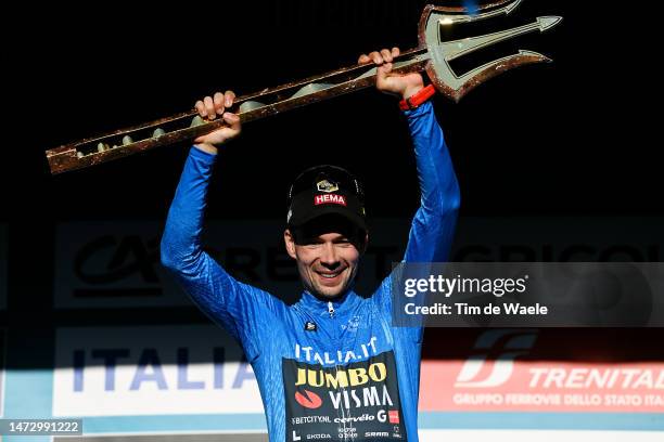 Primoz Roglic of Slovenia and Team Jumbo - Visma celebrates at podium as Blue Leader Jersey winner with the trident trophy during the 58th...