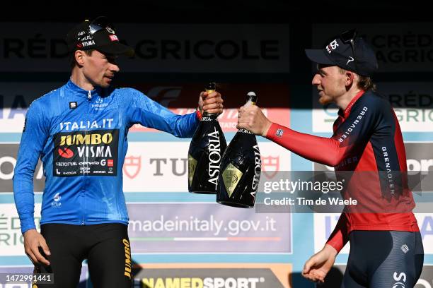 The race winner Primoz Roglic of Slovenia and Team Jumbo - Visma Blue Leader Jersey and third classified Tao Geoghegan Hart of The United Kingdom and...