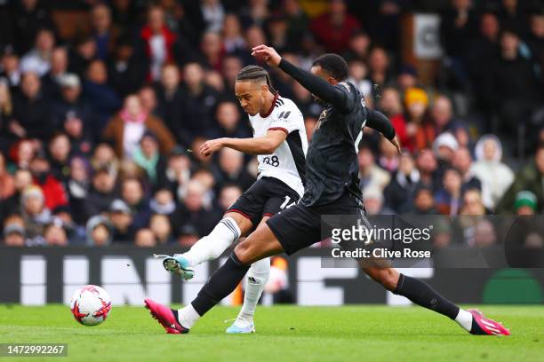 Bobby Reid of Fulham shoots whilst under pressure from Douglas Luiz of Aston Villa during the Premier League match between Fulham FC and Arsenal FC...