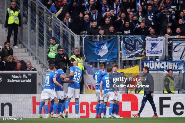 Angelo Stiller of TSG Hoffenheim celebrates with teammates after scoring the side's first goal during the Bundesliga match between Sport-Club...