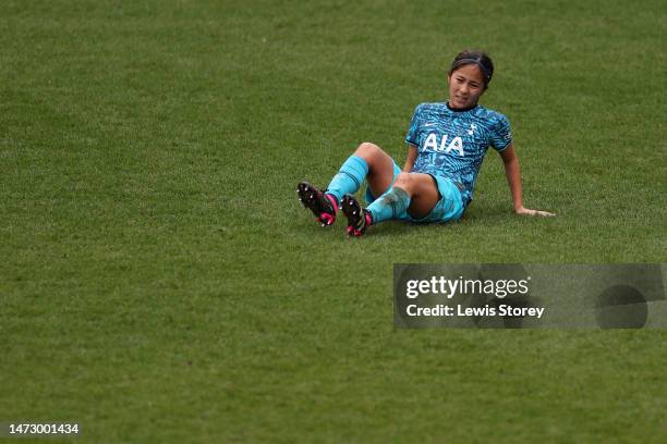 Mana Iwabuchi of Tottenham Hotspur reacts after picking up an injury before being substituted during the FA Women's Super League match between...
