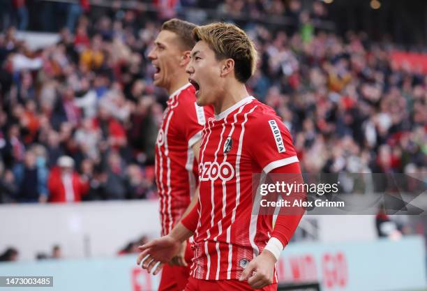 Ritsu Doan of Sport-Club Freiburg celebrates scoring the side's second goal during the Bundesliga match between Sport-Club Freiburg and TSG...