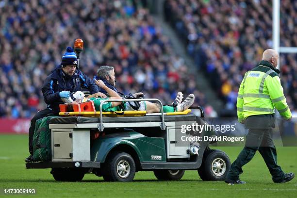 Garry Ringrose of Ireland gestures a thumbs up as they leave the field after receiving medical treatment during the Six Nations Rugby match between...