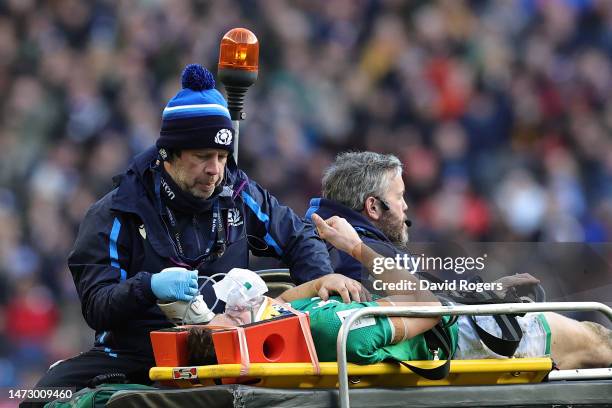 Garry Ringrose of Ireland gestures a thumbs up as they leave the field after receiving medical treatment during the Six Nations Rugby match between...