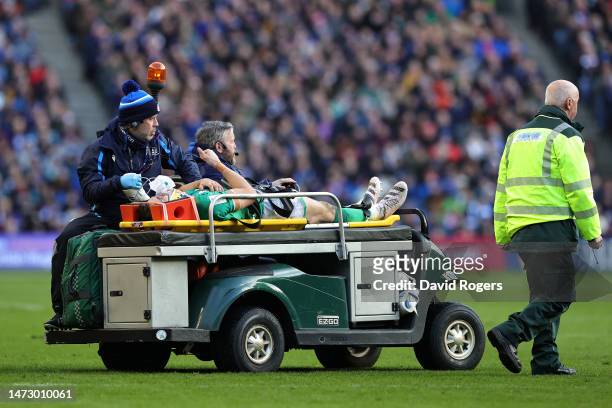 Garry Ringrose of Ireland gestures a thumbs up as they leave the field after receiving medical treatment during the Six Nations Rugby match between...