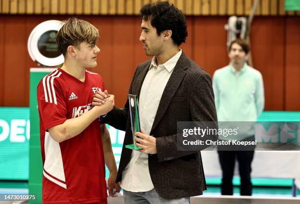 Daniel Gerlach, Futsal national coach U19 hands out the trophy for the best player of the A-Juniors competition to Samueol Barth of FC Memmingen on...
