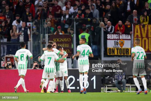Armand Lauriente of US Sassuolo celebrates with teammates after scoring the team's first goal during the Serie A match between AS Roma and US...