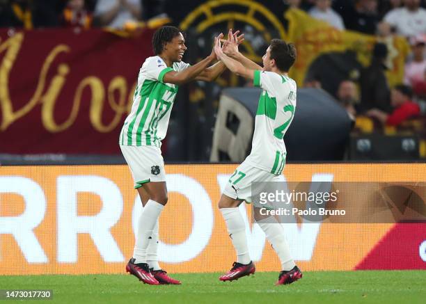 Armand Lauriente of US Sassuolo celebrates with teammate Maxime Lopez after scoring the team's second goal during the Serie A match between AS Roma...