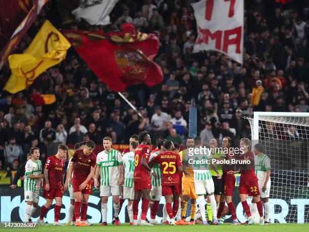 Players of AS Roma and US Sassuolo scuffle during the Serie A match between AS Roma and US Sassuolo at Stadio Olimpico on March 12, 2023 in Rome,...