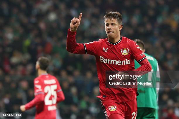 Adam Hlozek of Bayer 04 Leverkusen celebrates after scoring the team's third goal during the Bundesliga match between SV Werder Bremen and Bayer 04...