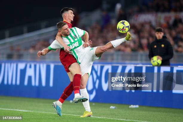 Roger Ibanez of AS Roma battles for possession with Domenico Berardi of US Sassuolo during the Serie A match between AS Roma and US Sassuolo at...