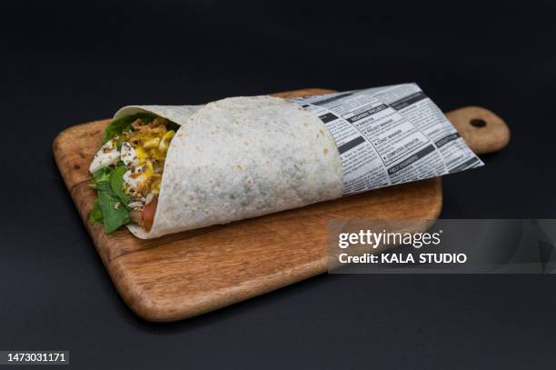 studio photo of a healthy wrapped sandwich - wrapped burrito stock pictures, royalty-free photos & images