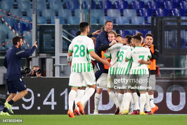 Andrea Pinamonti of US Sassuolo celebrates with teammates after scoring the team's fourth goal during the Serie A match between AS Roma and US...
