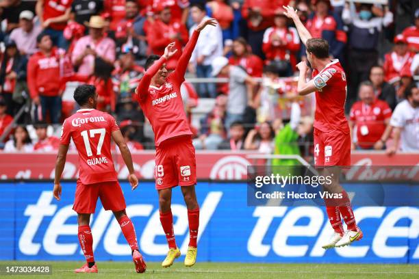 Edgar Lopez of Toluca celebrates with Marcel Ruiz of Toluca after scoring the team's second goal during the 11th round match between Toluca and...