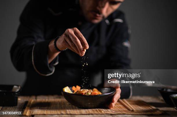 male chef preparing a bowl of noodle - chef finishing stock pictures, royalty-free photos & images