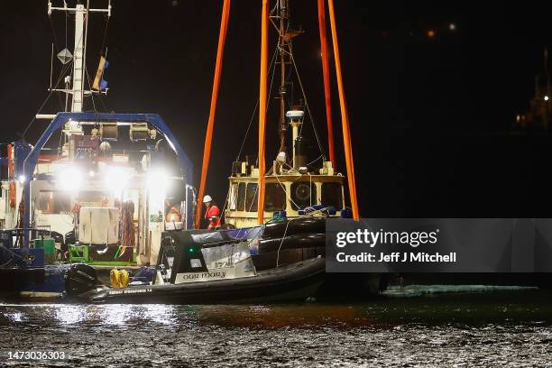 The crane ship Lara 1 from Liverpool starts the salvage operation to recover the tugboat that capsized in the River Clyde resulting in the loss of...