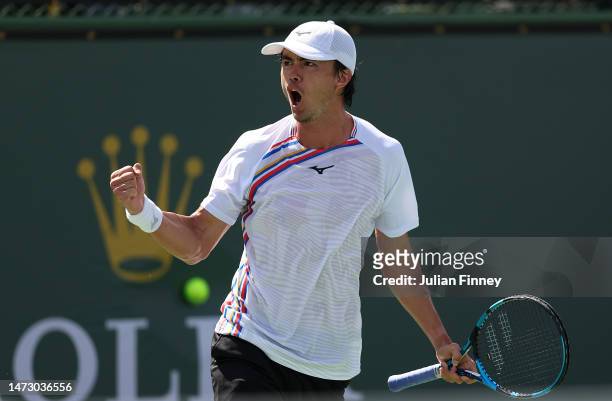Taro Daniel of Japan celebrates taking the first set against Cameron Norrie of Great Britain in action against during the BNP Paribas Open on March...