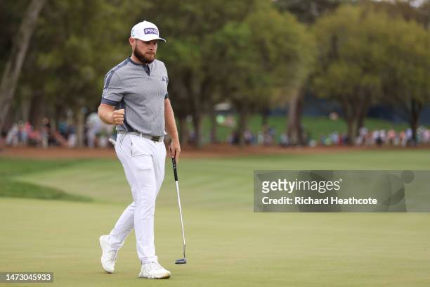Tyrrell Hatton of England celebrates his putt for birdie on the 18th green during the final round of THE PLAYERS Championship on THE PLAYERS Stadium...