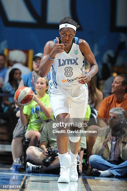 Taj McWilliams-Franklin of the Minnesota Lynx gives a thumbs up to her teammates during the game against the Phoenix Mercury on June 27, 2012 at...